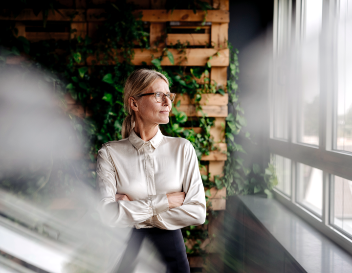 A woman looks out the window