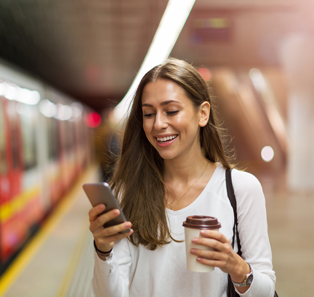 A woman on a mobile phone in the background is an underground