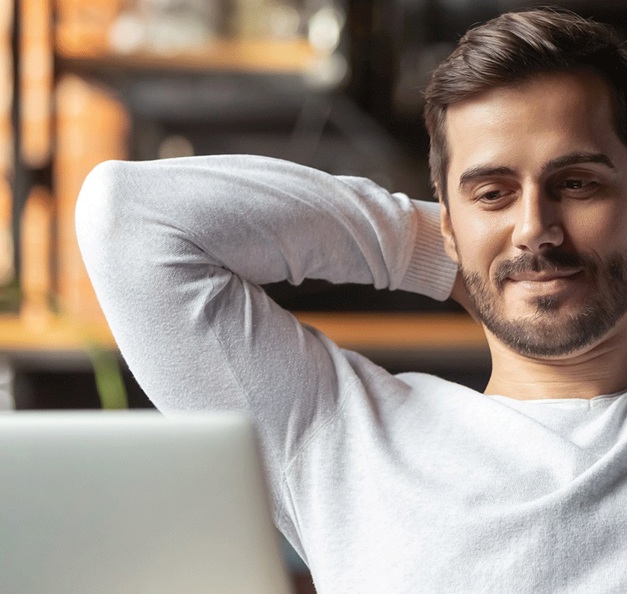 man in front of a laptop